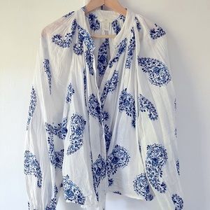 Light, semi-sheer blouse. White with blue paisleys. Elastic cuffs puffy sleeves.